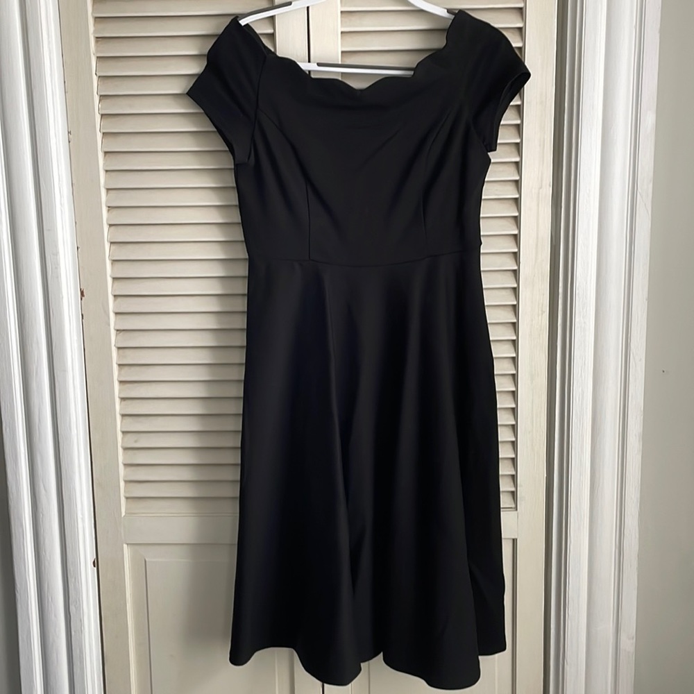 Off-the-shoulder formal black dress.